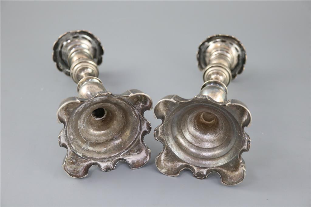 Two 19th century Brazilian? cast silver candlesticks,